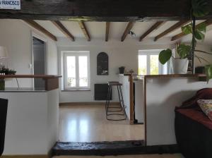 a living room with a counter and a table at Appartement de charme Coeur historique in Périgueux