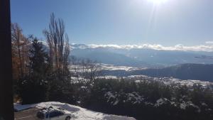a car parked on top of a snow covered mountain at Studio avec vue panoramique sur la montagne in Font-Romeu-Odeillo-Via