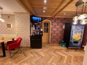 TV a/nebo společenská místnost v ubytování Landhaus Kössel