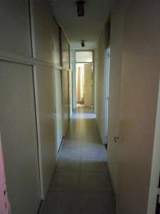 a hallway of an empty room with a long corridor at Maria Delicia in Godoy Cruz