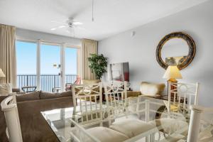 a living room with a couch and a table at Majestic Sun 1012A in Destin