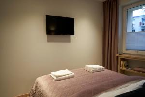 Posteľ alebo postele v izbe v ubytovaní Apartament Wołodyjowskiego