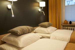 Posteľ alebo postele v izbe v ubytovaní Apartament Wołodyjowskiego