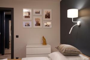 Posteľ alebo postele v izbe v ubytovaní Apartament Wołodyjowskiego