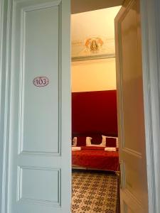 Postel nebo postele na pokoji v ubytování Hotel Valentino