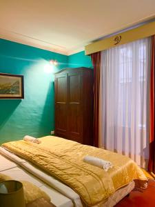 Postel nebo postele na pokoji v ubytování Hotel Valentino