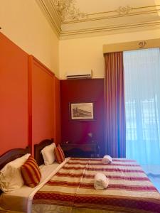 Postel nebo postele na pokoji v ubytování Hotel Valentino