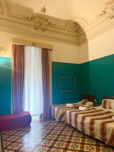 Postel nebo postele na pokoji v ubytování Hotel Valentino