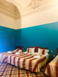 Postel nebo postele na pokoji v ubytování Hotel Valentino
