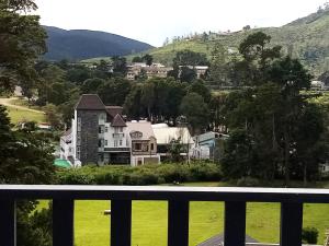 a view from the balcony of a house at Chanya Luxury Apartment, S 31, Lake View Residencies in Nuwara Eliya