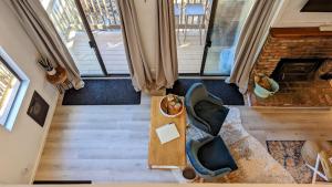an overhead view of a living room with a table and a couch at Cozy condo walking distance to village and gondola w/ pool/ jacuzzi sleeps 4. in Mammoth Lakes
