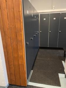 a row of lockers in a locker room at Lovely apartment with hot tub access in Akureyri