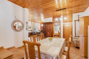 a kitchen and dining room with a table and chairs at House Eufrosyne in Moutoullas