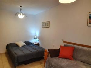 Postel nebo postele na pokoji v ubytování Apartamentos Grifo Vacances Grizzly