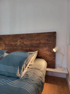Ένα ή περισσότερα κρεβάτια σε δωμάτιο στο Appartement La verrerie, terrasse et jardinet