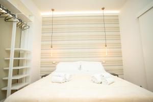 Säng eller sängar i ett rum på Modena Centro Junior Suite