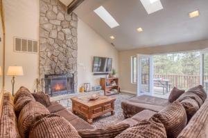 a living room with a couch and a fireplace at 068 - White Bear Lodge in Big Bear Lake