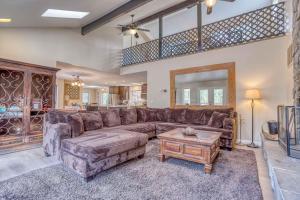 a living room with a couch and a table at 068 - White Bear Lodge in Big Bear Lake