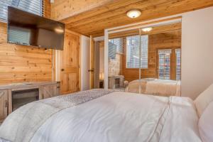 a bedroom with a bed and a flat screen tv at 019 - Almost Heaven in Big Bear Lake