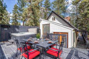 a patio with a table and chairs on a deck at 019 - Almost Heaven in Big Bear Lake