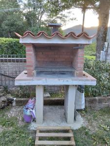 a brick oven sitting on top of a table at Casa Valentina in Colombara