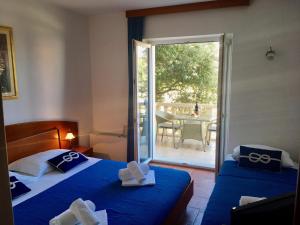 Posteľ alebo postele v izbe v ubytovaní Apartments Villa Jadranka Adults only