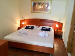Posteľ alebo postele v izbe v ubytovaní Apartments Villa Jadranka Adults only