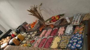 a bunch of different types of food on a shelf at Hotel Rüttenscheider Stern in Essen