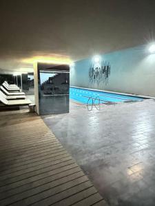 a room with a swimming pool in a building at Merkezi konumda şık daire in Istanbul