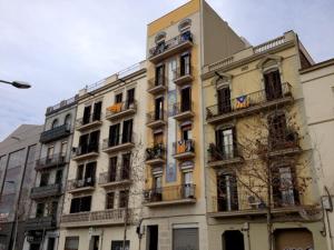 a tall building with balconies on the side of it at Lets Holidays Apartment Barcelona near beach in Barcelona