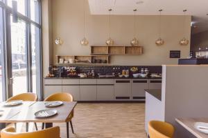 Kuchyň nebo kuchyňský kout v ubytování Hotel Libertas elements pure