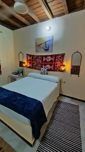 a bedroom with a large bed in a room at Kayan House in Tunis