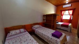 A bed or beds in a room at Morada Caminho do Mar