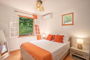 Postel nebo postele na pokoji v ubytování Villa Surelles - 3 chambres - piscine - Le Diamant