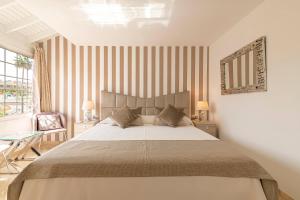 A bed or beds in a room at Apartment Terrazas La Caleta, Costa Adeje