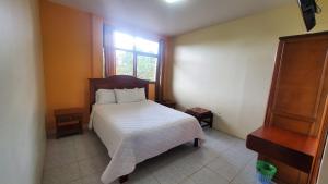 Postel nebo postele na pokoji v ubytování Hosteria Shell