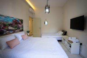 Voodi või voodid majutusasutuse Villa Magnolia in Manot toas