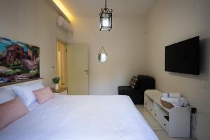 Voodi või voodid majutusasutuse Villa Magnolia in Manot toas