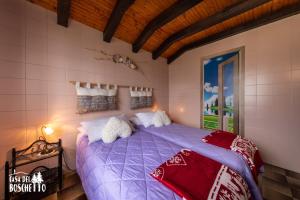 Ένα ή περισσότερα κρεβάτια σε δωμάτιο στο Casa Del Boschetto