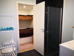 a bathroom with a shower and a toilet and a sink at Gjestehus i Sogndal in Sogndal