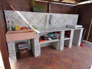 a pretend kitchen with a counter and a sink at Agriturismo Graziano e Barbara in Porto Conte
