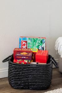a basket filled with books and other gifts at Friends and Family! Desert Oasis 3 Mi to Joshua Tree in Yucca Valley