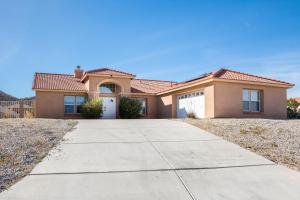 a house with a driveway in front of it at Friends and Family! Desert Oasis 3 Mi to Joshua Tree in Yucca Valley