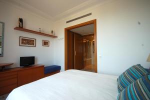 A bed or beds in a room at Lets Holidays Apartment Sea Views in Barcelona