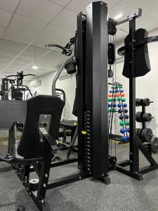 a gym with a computer monitor and a chair at HOTEL NAVEGANTES VISTA PARA MAR Boa Viagem in Recife