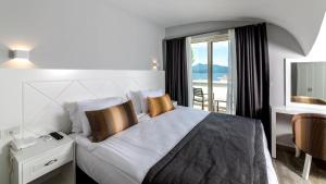 Кровать или кровати в номере Motto Premium Hotel&Spa