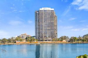 a tall building next to a large body of water at Bay View in Tweed Heads