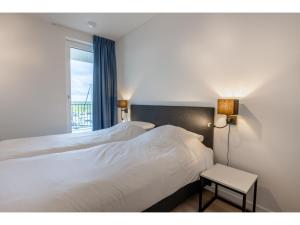 Ένα ή περισσότερα κρεβάτια σε δωμάτιο στο Loft in Zeeland by Marina and Veerse Meer