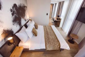 Postel nebo postele na pokoji v ubytování Hotel Libertas elements pure + 37 fotografií