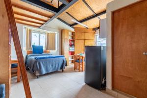 Ένα ή περισσότερα κρεβάτια σε δωμάτιο στο Lofts San Ángel